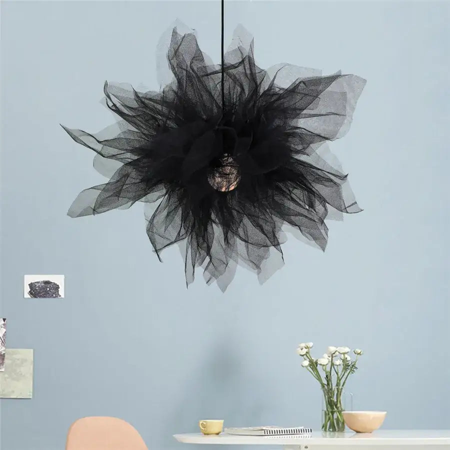 Modern white gauze flower pendant light featuring a black tulle chandelier with a central metallic bulb by decorbites gauze