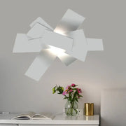 Modern white geometric ceiling light with angular layered panels for bedroom 110v-120v bulb base use