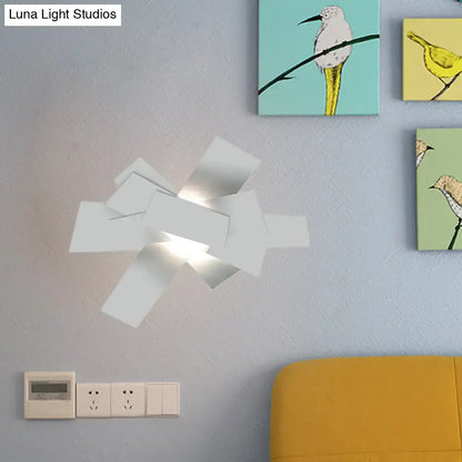Modern white geometric ceiling light with layered angular panels and 110v-120v bulb base for bedroom use