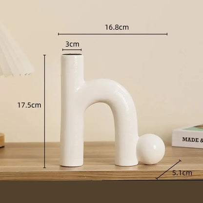 Modern white geometric ceramic candle holder with sleek abstract h shape and rounded base for living room decorbites decor