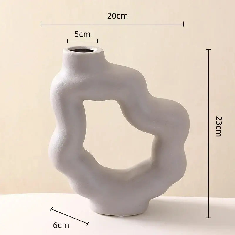 Modern white geometric ceramic flower vase with matte gray finish and organic contours for living room decorbites decor