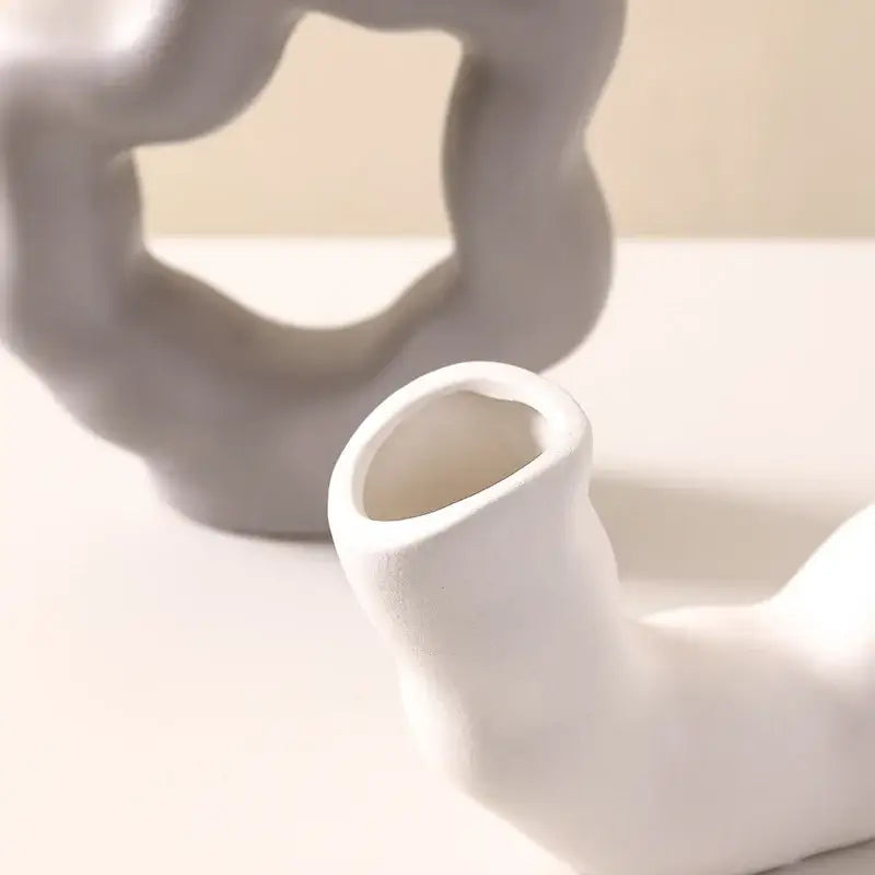 Modern white geometric ceramic flower vase with smooth abstract organic shape for living room decorbites decor
