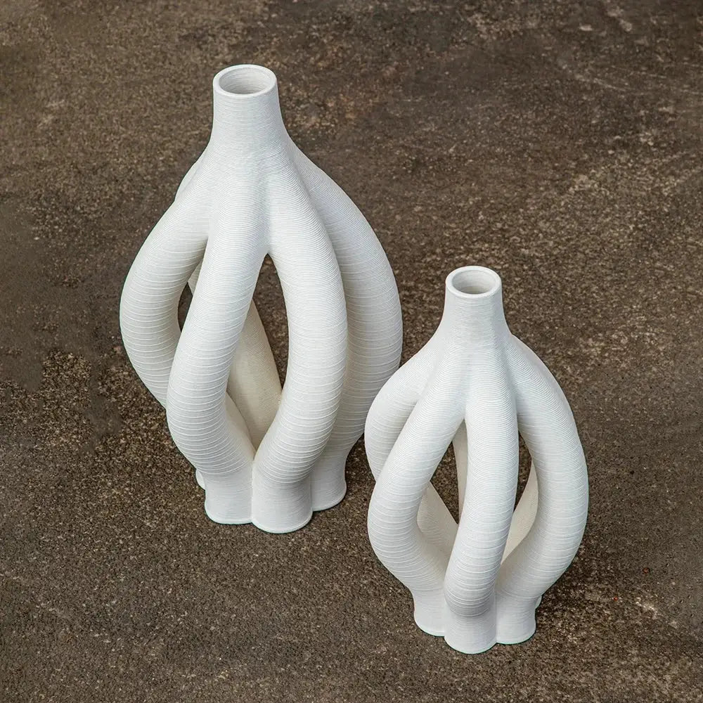 Modern white geometric ceramic hollow vases with intricately twisted design for living room decorbites decor