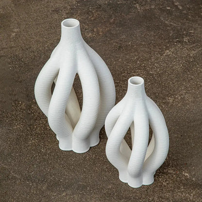 Modern white geometric ceramic hollow vases with intricately twisted design for living room decorbites decor