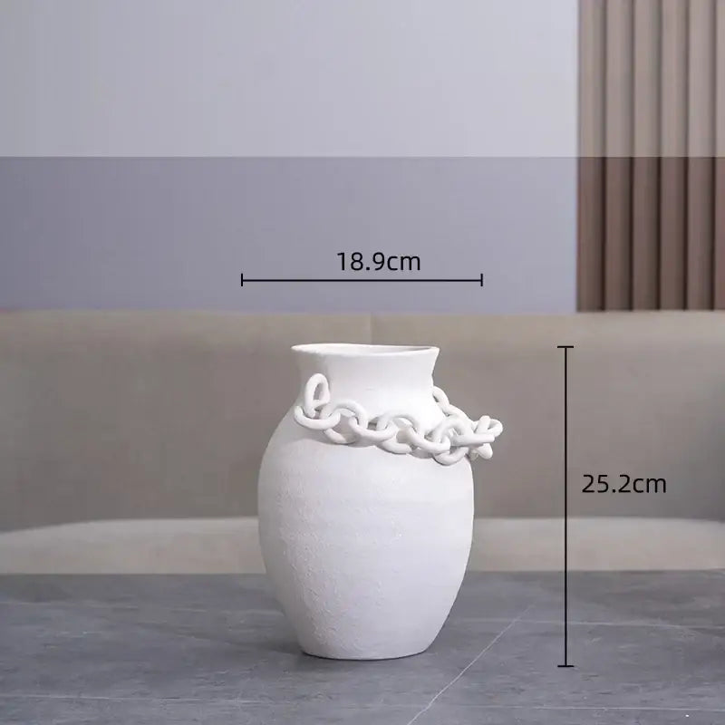Modern white geometric chain porcelain vase with textured surface and ornamental chain detail for living room decorbites decor