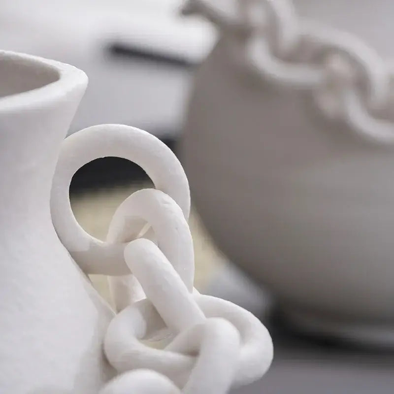 Modern white ceramic vase with a sculpted geometric chain porcelain handle for decorbites geometric chain decor