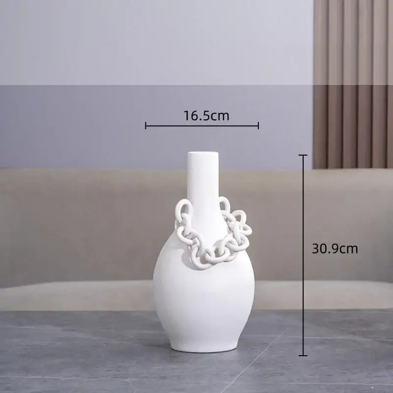 A sleek white geometric chain porcelain vase with slender neck and rounded body for modern living room decor
