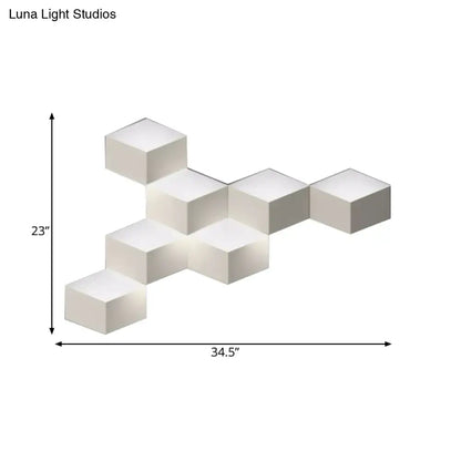 Off-white cube-shaped modular wall lamp with a modern white geometric design light fixture for living room use