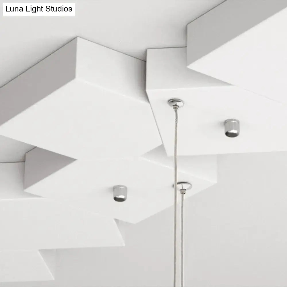 Modern white geometric led island light with sleek chrome fixtures and minimalist design for kitchen or living room
