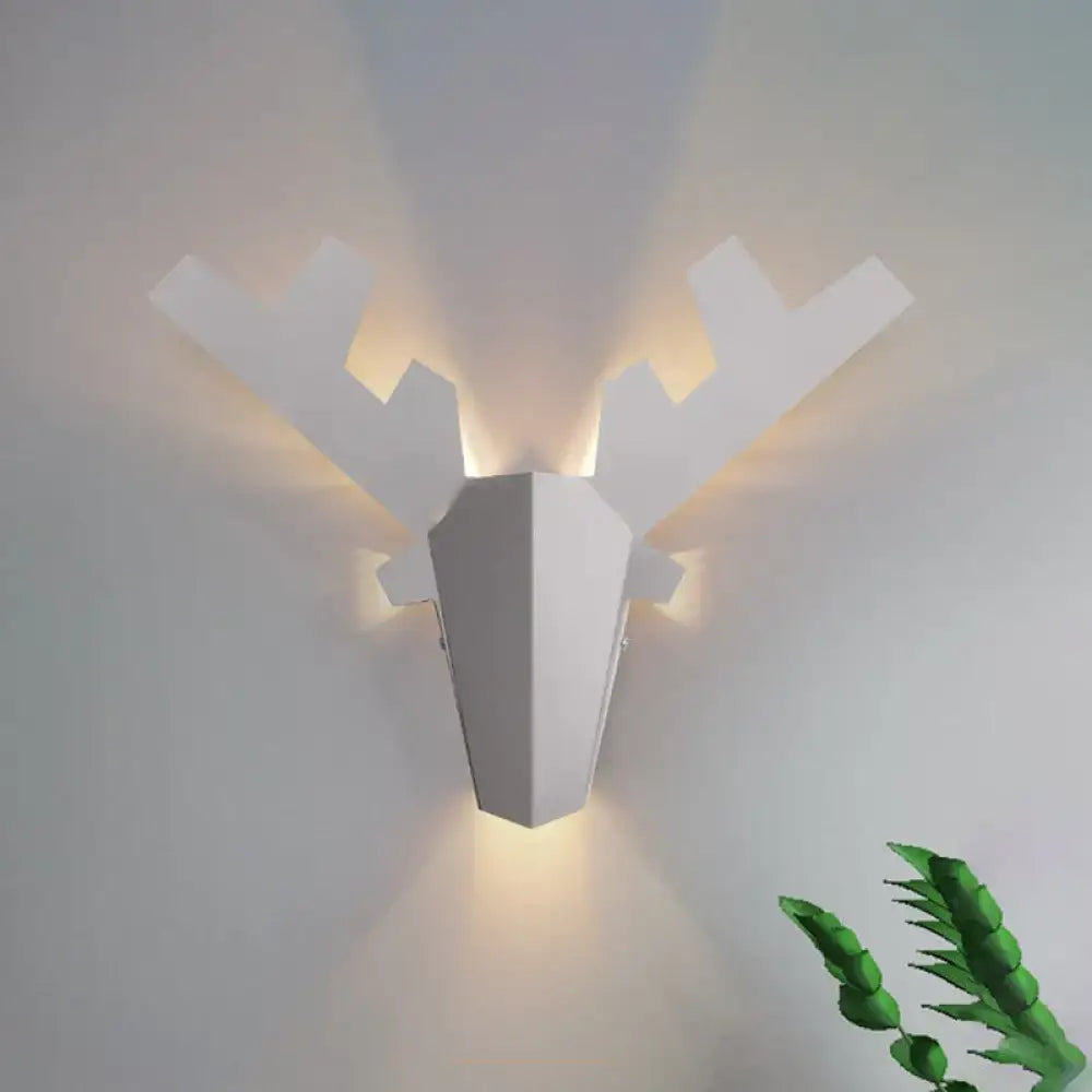 Modern white geometric reindeer wall lamp featuring a warm directional light type for bedroom sconce use