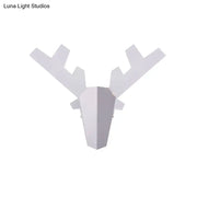 Modern white geometric reindeer wall lamp with angular antlers and minimalist design for bedroom light type use