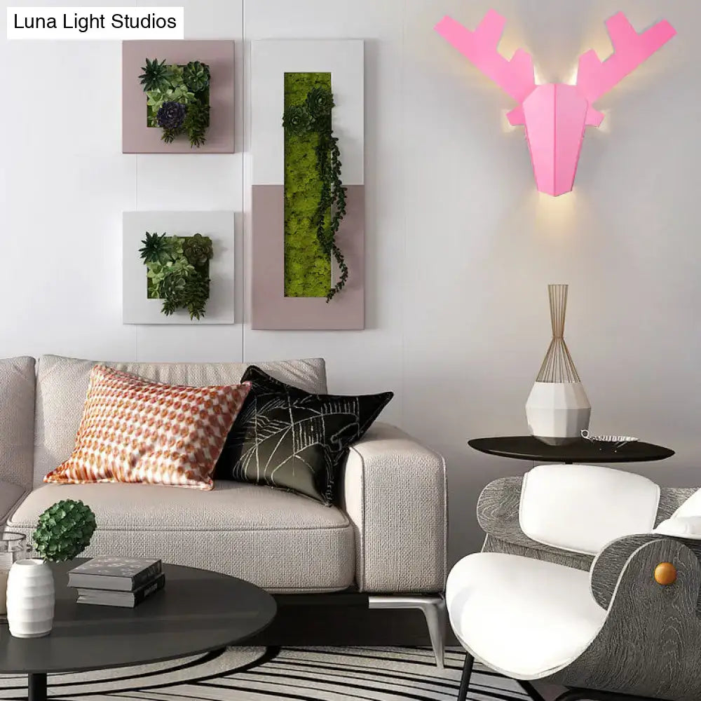 Pink geometric deer head wall lamp featuring modern white design for bedroom sconce light type illumination
