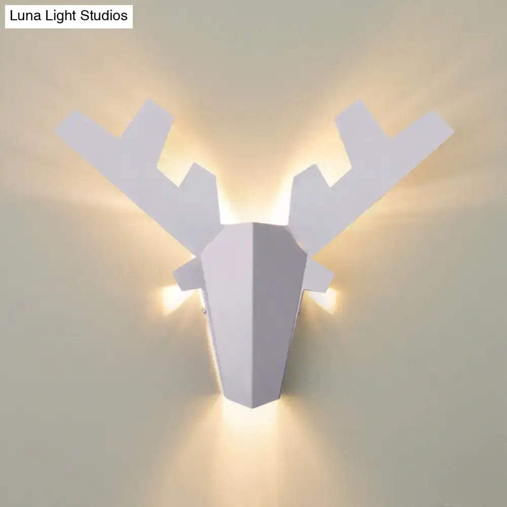 Modern white geometric reindeer wall lamp with warm ambient lighting as a bedroom sconce light type