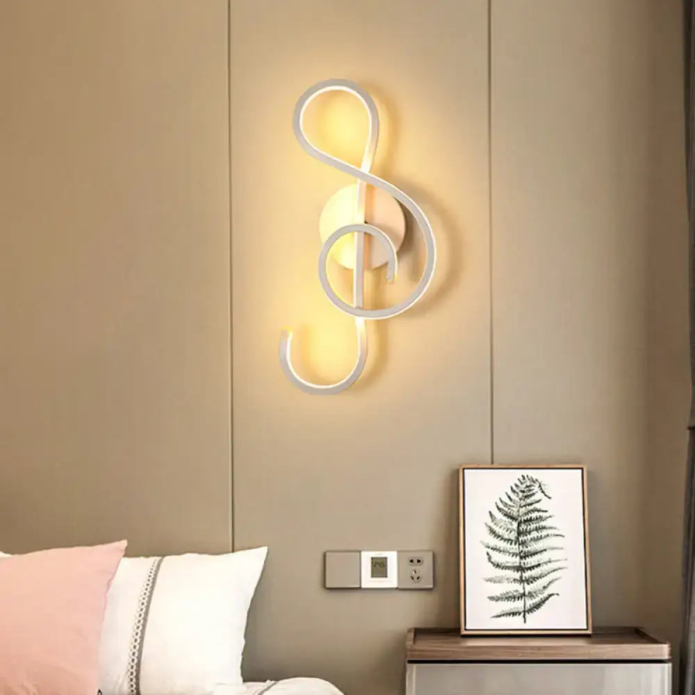 Modern white geometric twisted led wall lamp shaped like a treble clef emitting warm light for stairway use