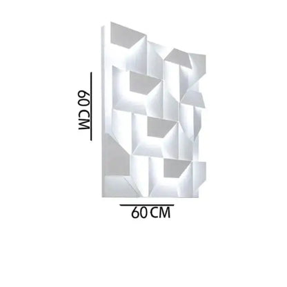 Modern white geometric wall lamp with faceted 3d design illuminating a living room as decorative art panel