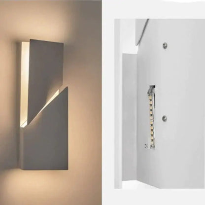 Modern white geometric wall lamp with sleek gray angular design and warm LED lighting for living room art illumination