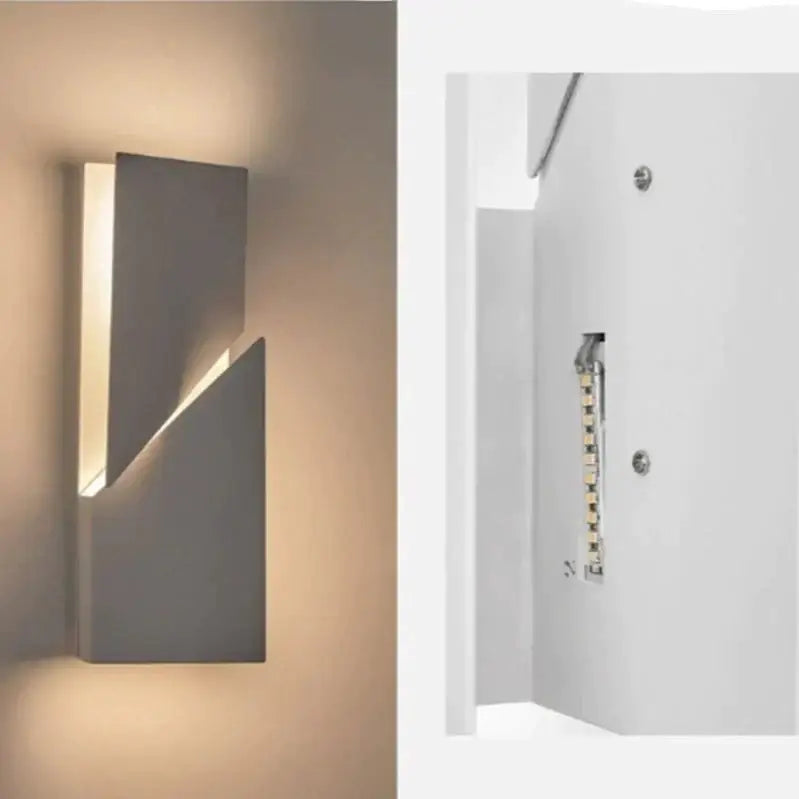 Modern white geometric wall lamp with sleek gray angular design and warm LED lighting for living room art illumination