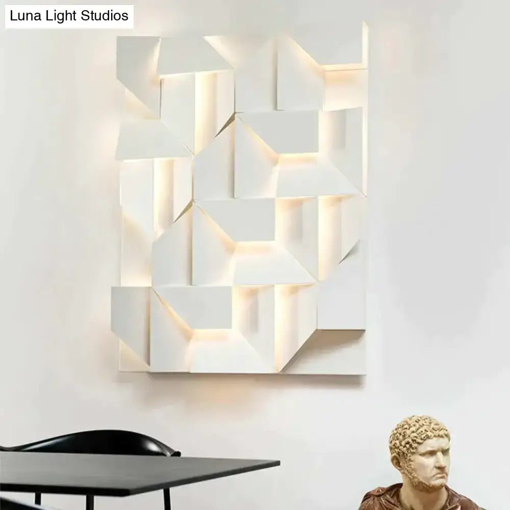 Modern white geometric wall lamp with illuminated recessed panels for stylish living room lighting and decor