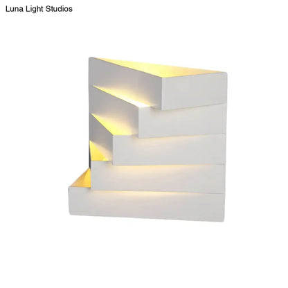 Modern white stepped led wall mounted lighting with warm yellow backlighting for living room sconce ambiance