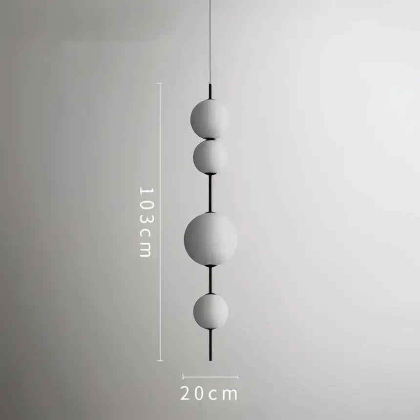 Modern white glass ball led pendant light with four matte glass spheres suspended by a black rod for kitchen decorbites pendant light