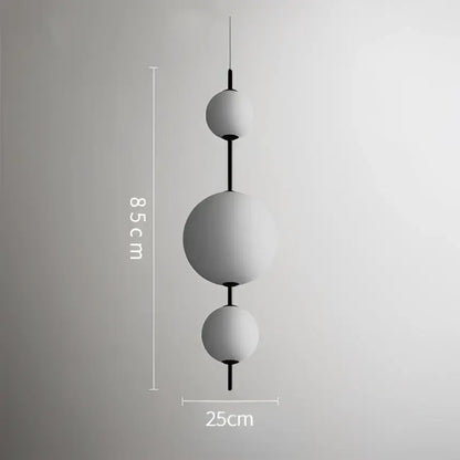 Modern white glass ball led pendant light with matte finish and black rods for kitchen and dining room decorbites decor