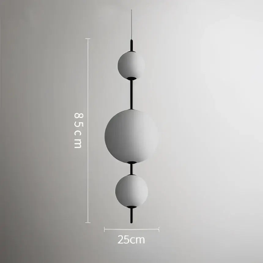 Modern white glass ball led pendant light with matte finish and black rods for kitchen and dining room decorbites decor