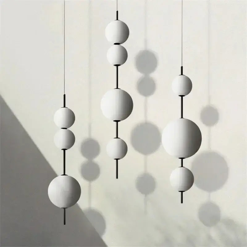 Modern white glass ball led pendant light with black rods for kitchen and dining room decorbites glass ball design