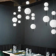 Modern white glass ball led pendant light with black rods perfect for kitchen and dining room decorbites glass ball decor