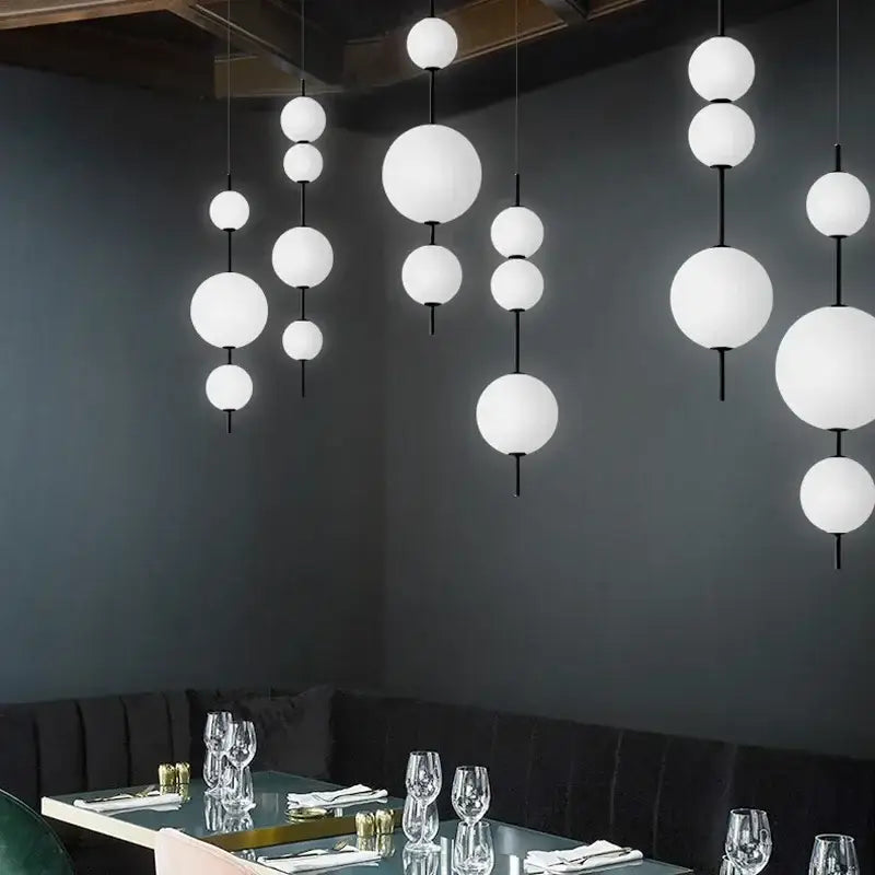 Modern white glass ball led pendant light with black rods perfect for kitchen and dining room decorbites glass ball decor