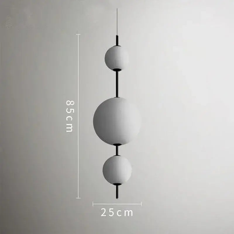 Modern white glass ball led pendant light with matte finish and black rods measuring 85 cm for kitchen decorbites glass ball