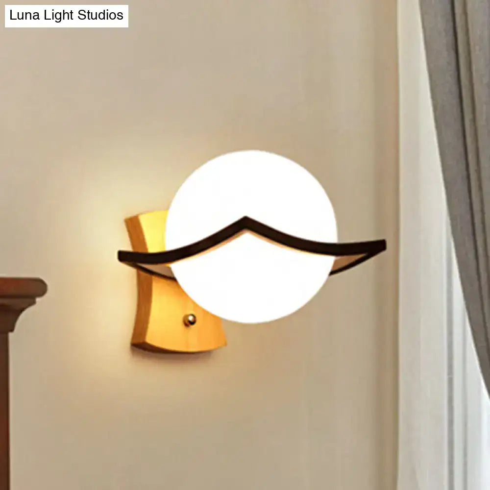 Modern white glass ball sconce with black mustache accent and direct wired electric for bedroom great addition