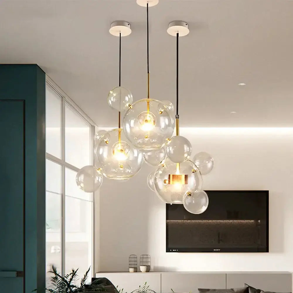 Modern white glass bubble chandelier with gold-toned accents and black cords pendant light for living room decorbites glass bubble
