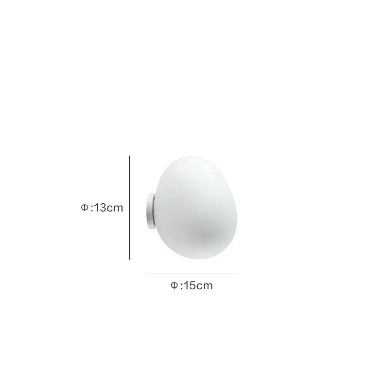 Modern white glass egg wall lamp with frosted globe and metallic base for bedroom featuring elegant egg wall sconces