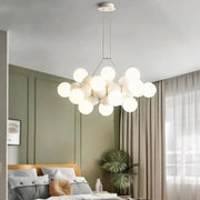 Modern white glass globe pendant light fixture with minimalist metal frame for dining room lighting