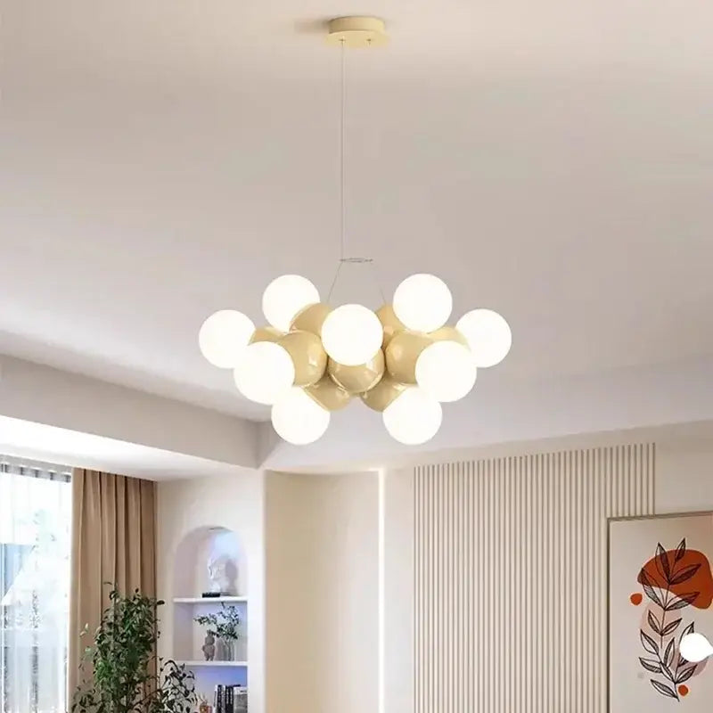 Modern white glass globe pendant light fixture with cream and white spherical bulbs for dining room lighting