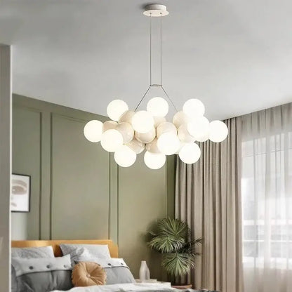 Modern white glass globe pendant light fixture with minimalist metal frame designed for dining room lighting