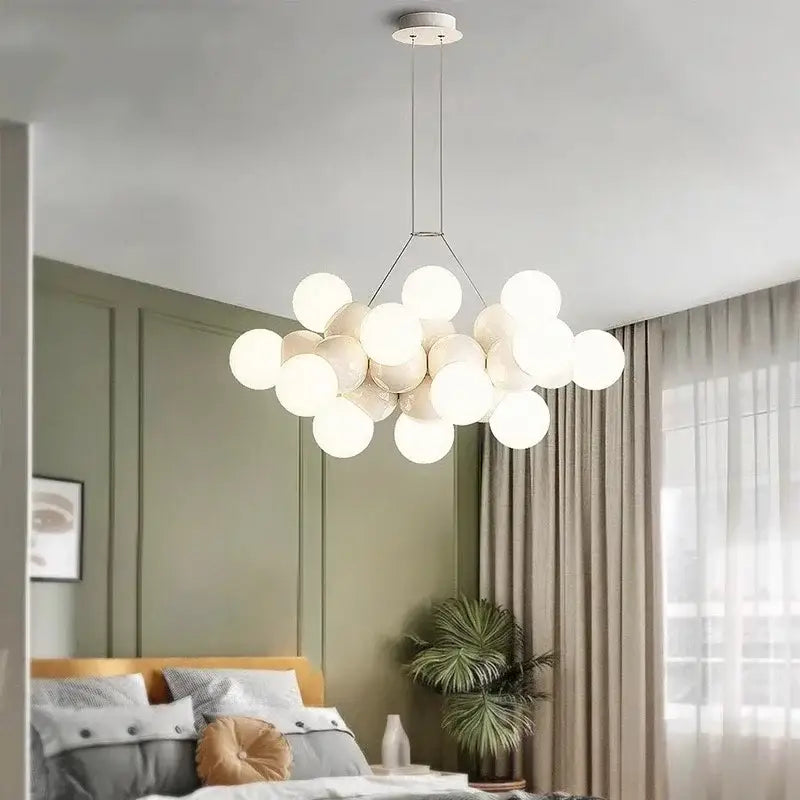 Modern white glass globe pendant light fixture with minimalist metal frame designed for dining room lighting