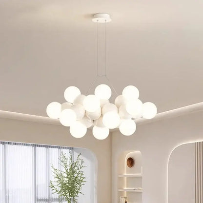 Modern white glass globe pendant light fixture featuring spherical glass pendant lights in a cluster design for dining room