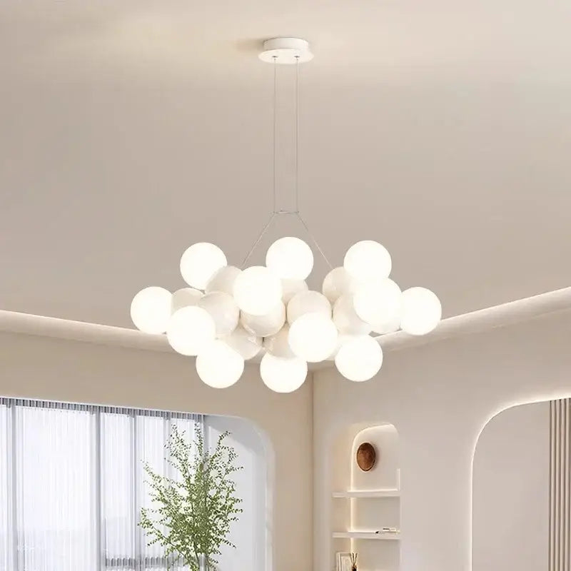 Modern white glass globe pendant light fixture featuring spherical glass pendant lights in a cluster design for dining room