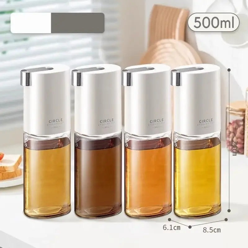 Set of four 500ml clear glass oil pots with white caps and silver accents for kitchen seasoning bottles
