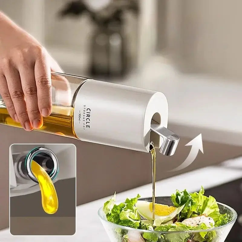 Modern white glass oil pot set with ceramic seasoning bottle pouring golden olive oil over fresh salad