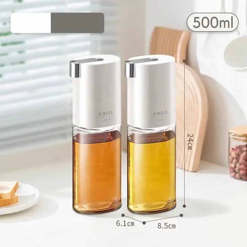 Two white glass automatic oil dispensers with silver caps containing golden liquid for seasoning bottle use