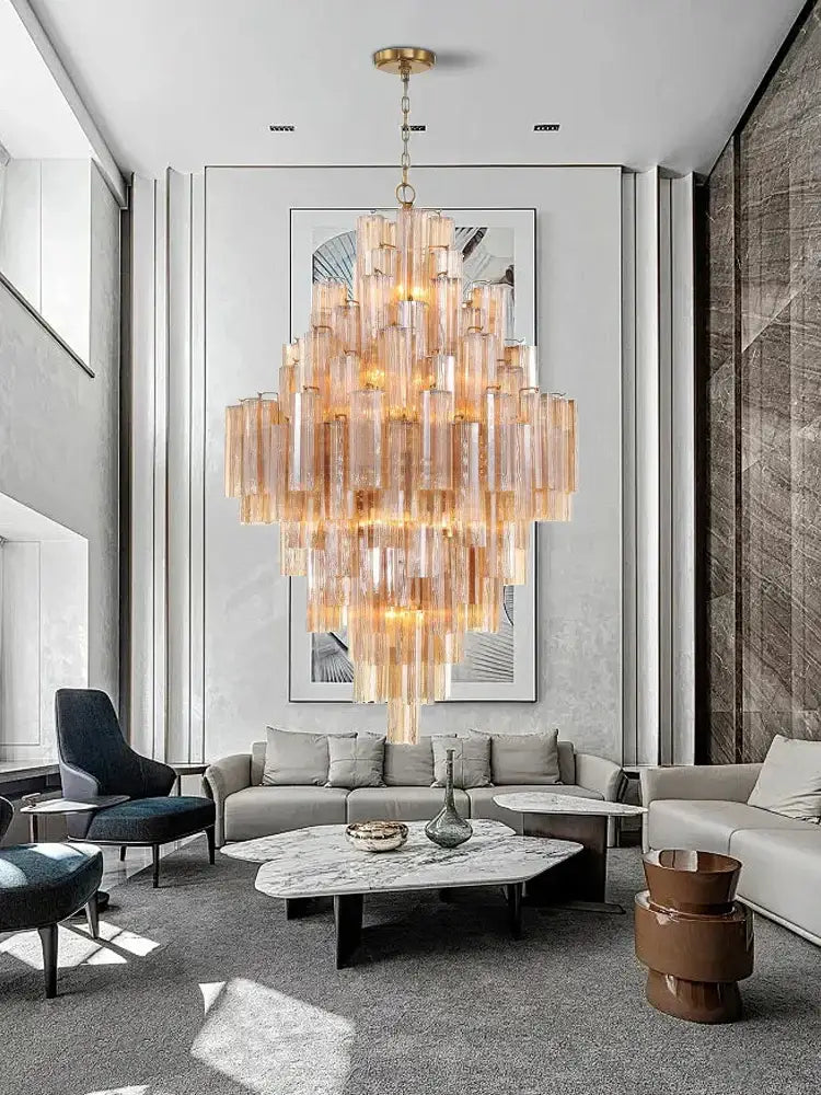 Modern white glass pendant lights featuring cascading amber-tinted glass tubes and gold finish for dining room decorbites big white