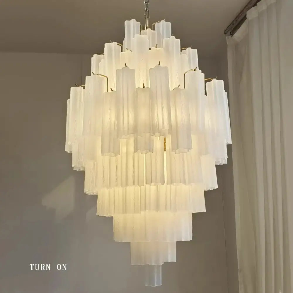 Modern white glass pendant lights featuring big white glass tubes in a cascading chandelier for dining room decorbites big white
