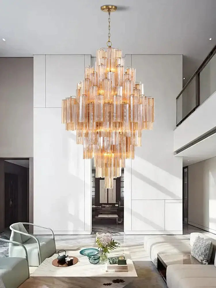 Modern white glass pendant lights with cascading amber-tinted glass tubes featured in decorbites big white chandelier
