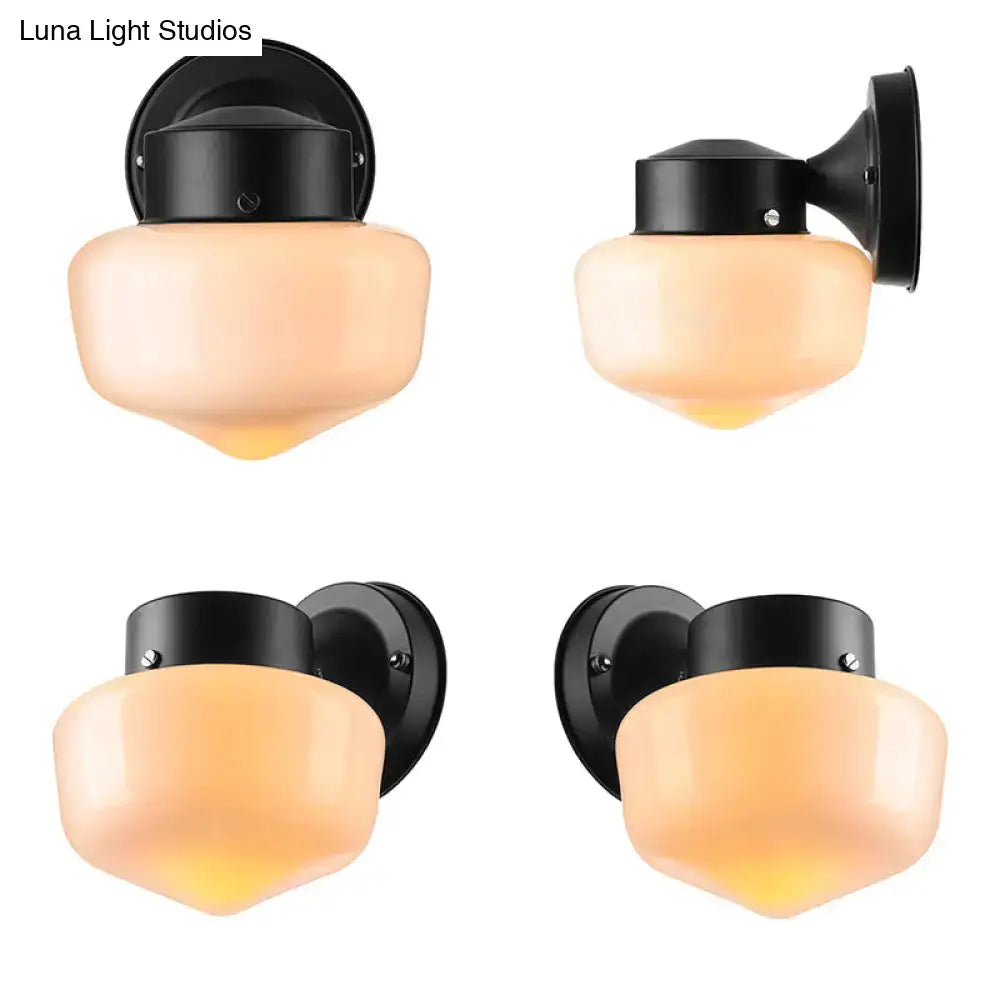 Black wall-mounted sconce light with frosted peach glass shades for modern white glass sconce light and black white mirror