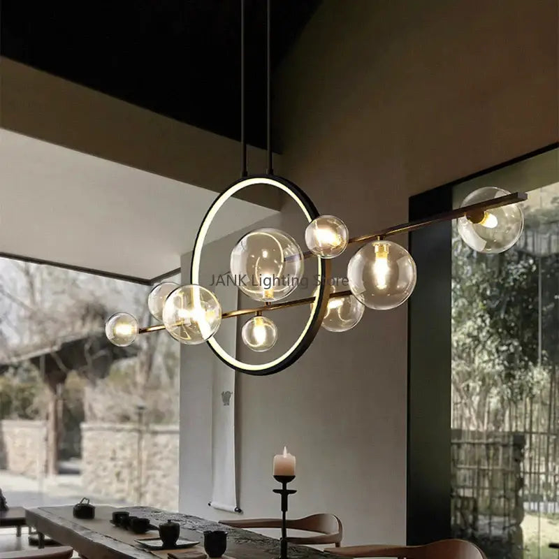 Modern white glass strip bubble chandelier with circular frame and brass rods featuring multiple glass globe bulbs