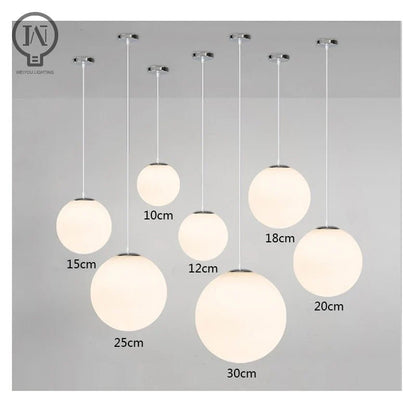 Modern White Globe Glass Pendant Light in Gold, Black, or Silver - Decorbites