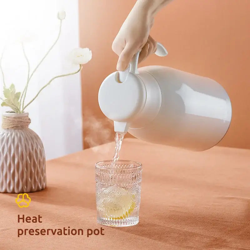 Modern white glossy ceramic decorbites glass insulation kettle with ergonomic handle for efficient heat preservation