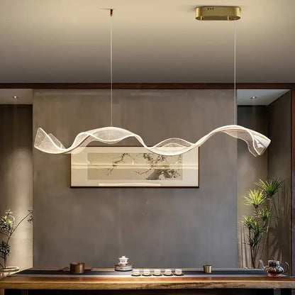 A modern white and gold acrylic ribbon led ceiling chandelier with wave-shaped translucent mesh and warm white decorbites acrylic ribbon lighting